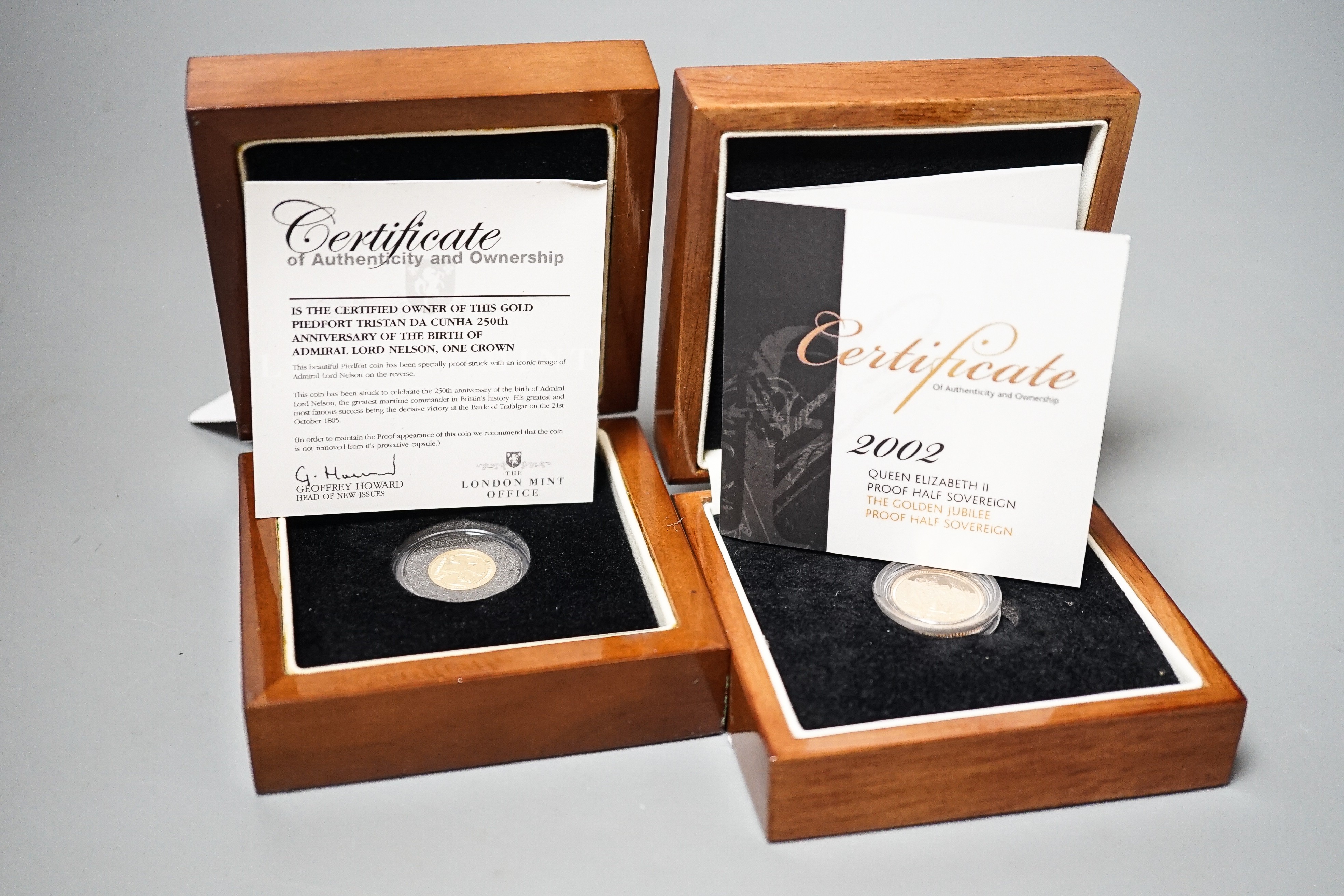 A Queen Elizabeth II gold proof half sovereign 2002 and a London mint Tristan Da Cunha gold piedfort one crown, cased with certificates (2)